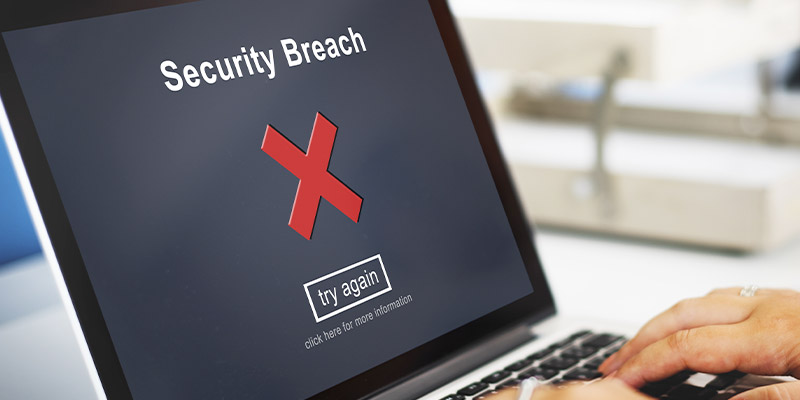 Un écran d'ordinateur portable qui affiche le message "faille de sécurité"