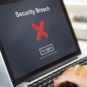 Un écran d'ordinateur portable qui affiche le message "faille de sécurité"